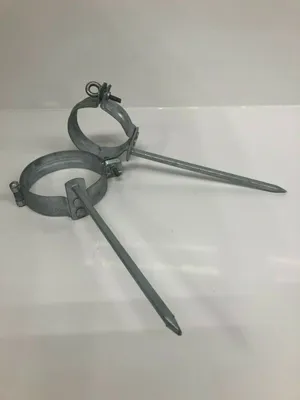Two metal pipe clamps with spikes are shown on a white background.