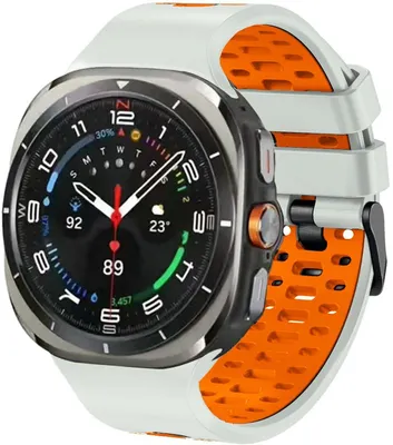 Produktbild von Stravo Zweifarbiges Silikon-Sportarmband für Samsung Galaxy Watch Ultra 2/Ultra 47 mm – Atmungsaktiv, Luftlöcher und Dornschließe – Starlight/Orange
