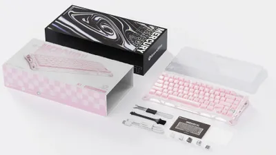 The image shows the packaging and contents of a pink mechanical keyboard.