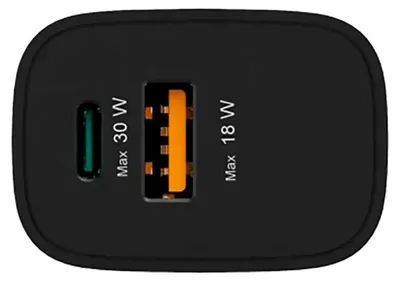 Close-up view of a black USB charger with two ports.