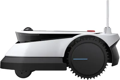 Side view of a white and black robotic lawnmower.