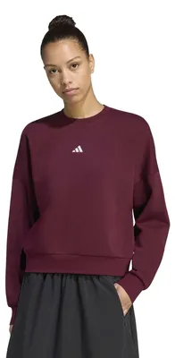 Immagine prodotto di Felpa da donna adidas Essentials, con piccolo logo, vestibilità comoda e rilassata, colore bordeaux/bianco