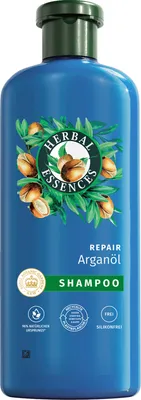 A blue bottle of Herbal Essences shampoo with argan oil.
