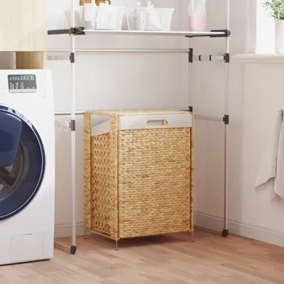 A laundry room scene with a washing machine and a wicker laundry basket.