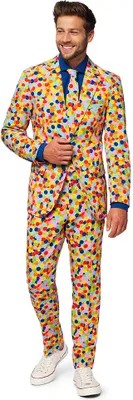 A man wearing a colorful confetti-patterned suit stands against a white background.