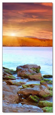 Produktbild von Wallario selbstklebende Türtapete 93 x 205 cm mit Schutzlaminat - Sonnenaufgang am Meer mit Landzunge und Felsen im Wasser