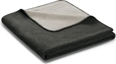 A folded blanket with a contrasting inner lining.