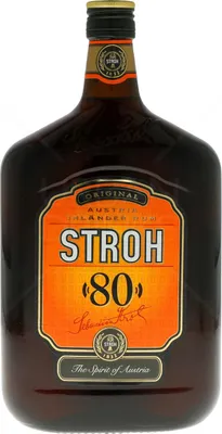 A bottle of Stroh 80 Rum against a white background.