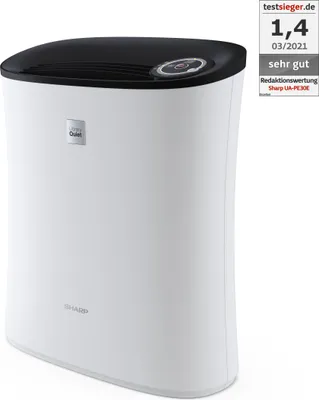 A white and black air purifier is shown against a white background. A small rating badge is visible in the top right corner.