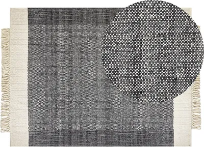 Produktbild von BELIANI Teppich Cremeweiß / Schwarz Wolle 160 x 230 cm Rechteckig Handgewebt Streifenmuster Kurzflor mit Fransen Boho Wohnzimmer Schlafzimmer Flur