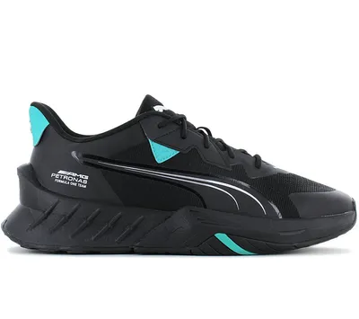 A black Puma sneaker with teal accents, shown from the side.