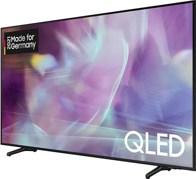A side view of a Samsung QLED television with a colorful abstract image displayed on its screen.