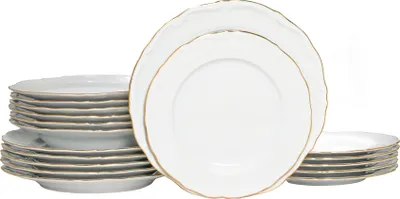 A stack of white plates with gold trim against a white background.