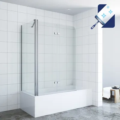 A modern bathroom with a bathtub and a glass shower screen.