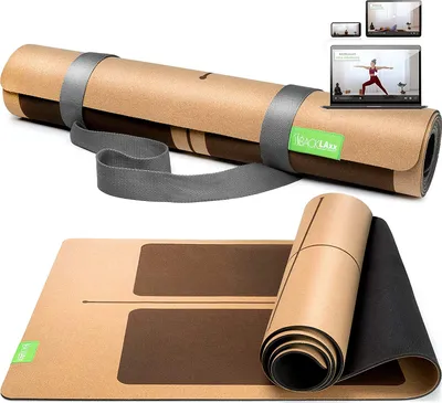 A yoga mat is shown rolled up and unrolled, with a laptop and tablet displaying a yoga class in the background.
