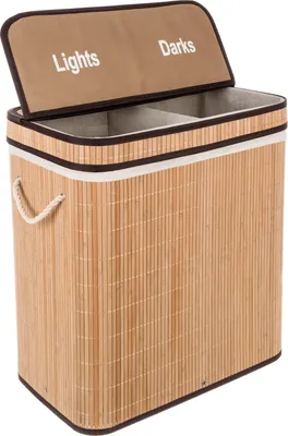 A laundry basket with two compartments, labeled 'Lights' and 'Darks', made of natural bamboo.