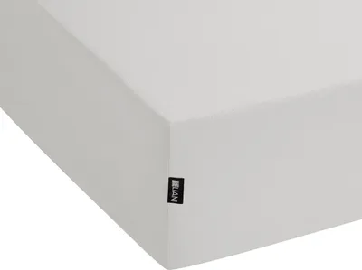 A close-up view of a light gray fitted sheet, showing its texture and a small black brand tag.