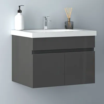 A modern bathroom vanity with a sink and faucet.