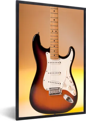 Produktbild von MuchoWow® Gerahmtes Poster Eine E-Gitarre mit orangefarbenem Hintergrund 60x90 cm - Poster mit Schwarzem Bilderrahmen Wandposter Rahmen Foto Bilder - Kunst