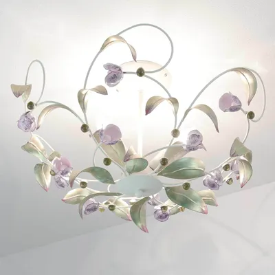 A close-up view of a decorative ceiling light fixture with a floral design.
