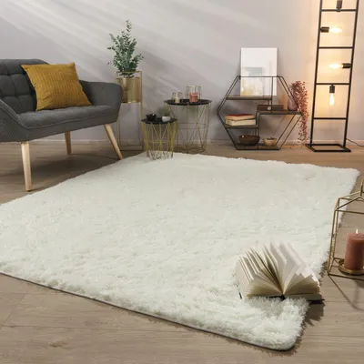 A fluffy white rug in a modern living room setting.