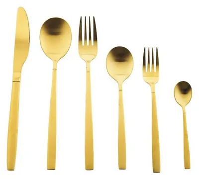 A set of gold-colored cutlery arranged in a line against a white background.