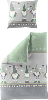 A pillow and a folded duvet cover with a gnome and star pattern.