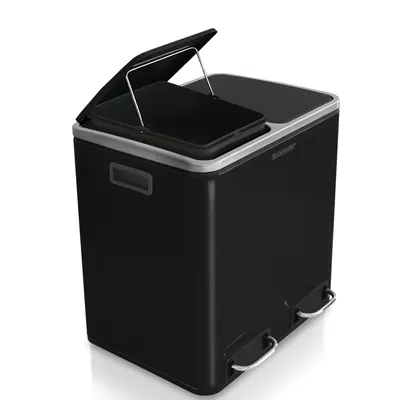 A black dual-compartment trash can with silver pedal levers and trim, shown from a slightly elevated diagonal angle against a white background.