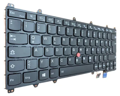 A black keyboard with German keycaps, shown at an angle on a white background.