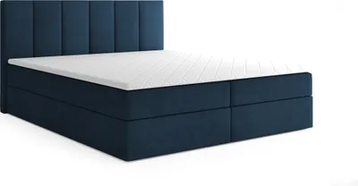 A dark blue boxspring bed with a white mattress and topper, shown from a side-angle on a white background.