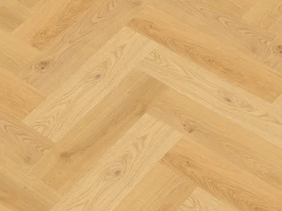 A close-up, overhead view of a herringbone-patterned wooden floor.