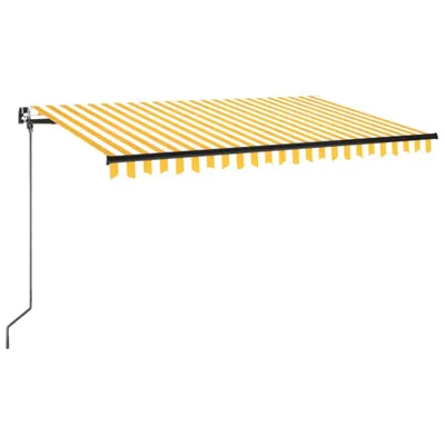 A retractable awning with yellow and white stripes, mounted on a wall.