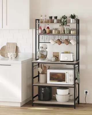 A kitchen shelf unit with various kitchen appliances and items.