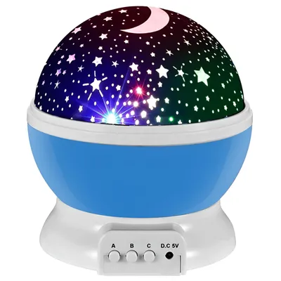 A star projector night light with a blue base and a dome projecting stars and a moon.