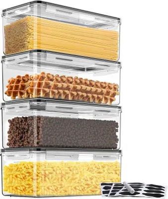 Four clear plastic food storage containers stacked vertically, filled with different food items.