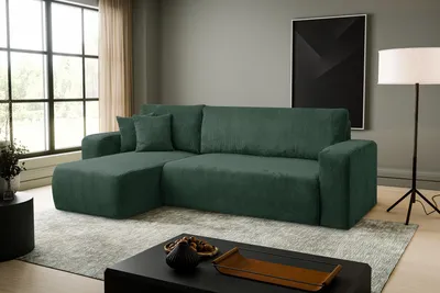A dark green sectional sofa is shown in a modern living room setting with a large window and a floor lamp.