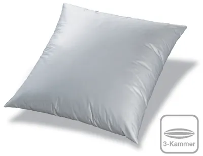 A white pillow on a white background with a small graphic and text in the bottom right corner.