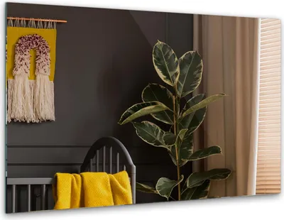A room interior with a plant, a crib with a yellow blanket, and a tapestry on the wall.