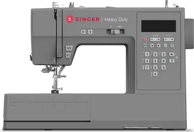 A studio shot of a gray Singer Heavy Duty sewing machine against a white background.