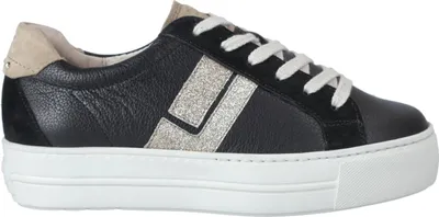 A side view of a black sneaker with silver accents and a white sole.
