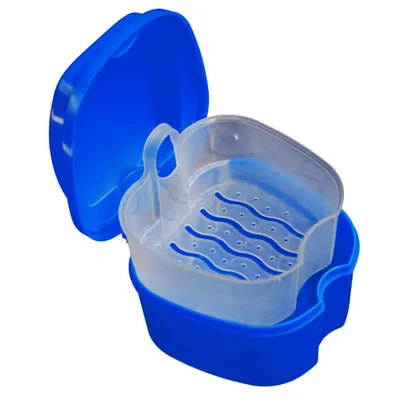 An open blue and clear plastic container for dentures or false teeth, with a removable inner tray with drainage holes.