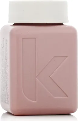 A small pink bottle with a white cap and a large embossed 'K' logo.