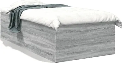 A bed frame with bedding.