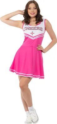A woman is posing in a cheerleader costume.