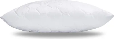 A white quilted pillow is shown from the side against a white background.