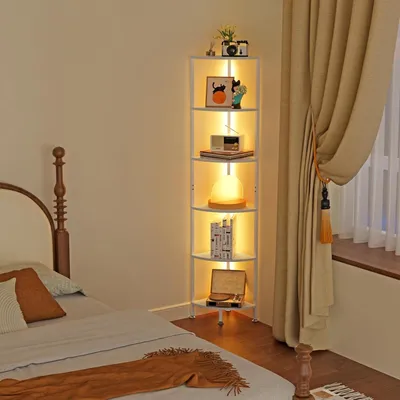 A bedroom scene with a bed, a corner shelf unit with LED lighting, and curtains.