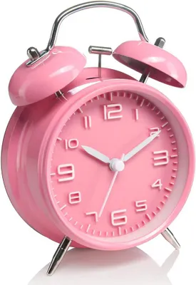A pink analog alarm clock with silver bells and feet, shown against a white background.