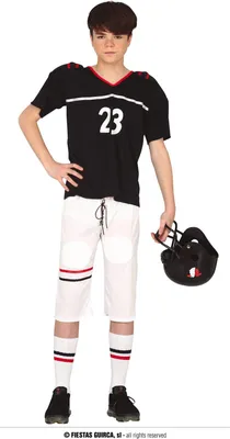 A young boy is posing in a football uniform.
