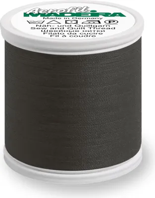 A spool of dark gray thread on a white background.