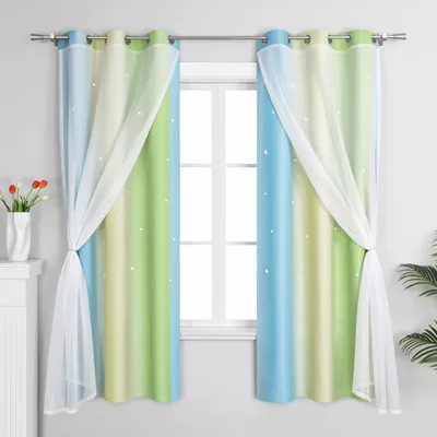 Two gradient curtains with sheer overlays are hung on a window rod, framing a window.